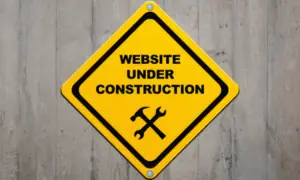 a sign saying website under construction