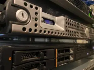 A server with equipment stacked on top of it hosting a website