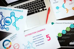 A laptop covered with distribution channel marketing strategies